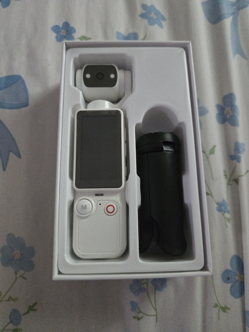 Compact White Handheld Digital Camera with Built-In Screen
